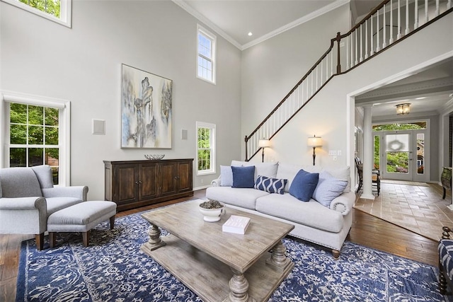 140 Golfview Dr, Adams Twp, PA 15044 - living area featuring a towering ceiling, ornamental molding, hardwood / wood-style floors, and stairway