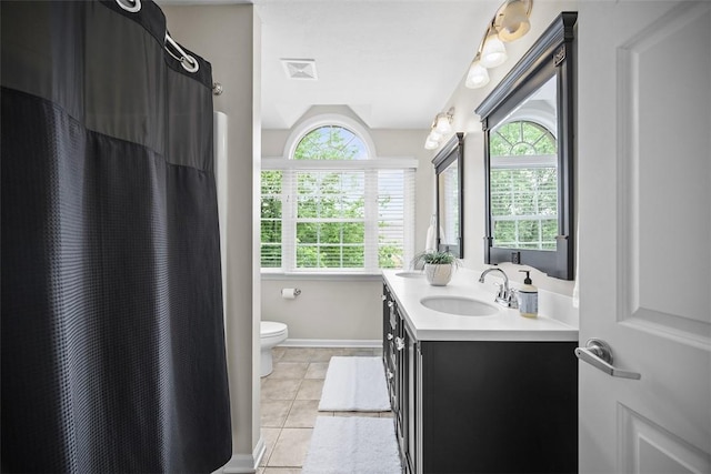 140 Golfview Dr, Adams Twp, PA 15044 - full bathroom featuring double vanity, tile patterned flooring, plenty of natural light, and a shower with shower curtain