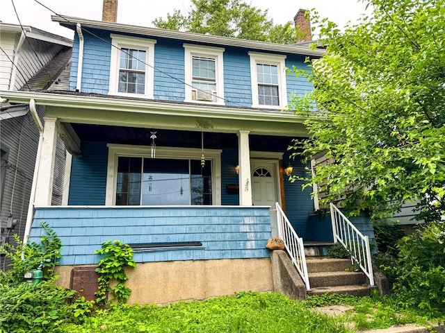 2406 Banker St, Mckeesport, PA 15132 - view of front of home with a chimney and covered porch