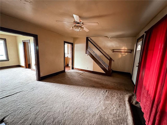 2406 Banker St, Mckeesport, PA 15132 - unfurnished living room with carpet floors, stairway, and a ceiling fan