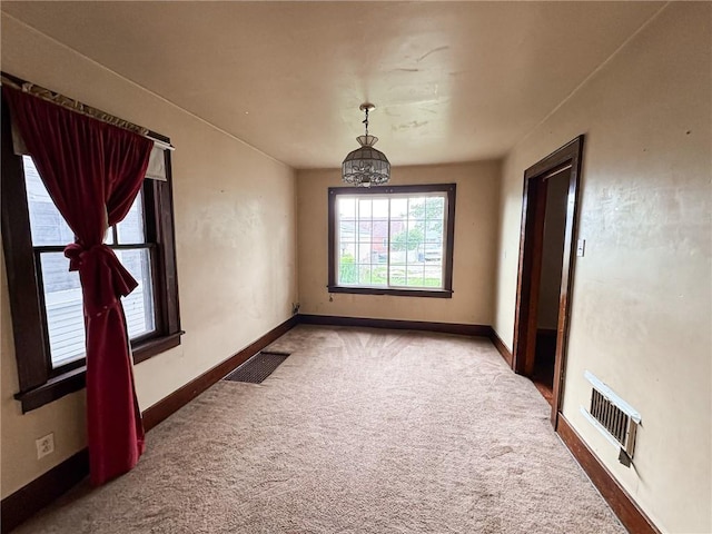 2406 Banker St, Mckeesport, PA 15132 - carpeted empty room featuring a chandelier and baseboards