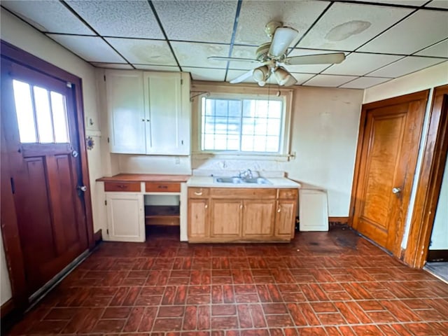 2406 Banker St, Mckeesport, PA 15132 - kitchen with a drop ceiling, brick patterned flooring, ceiling fan, and light countertops