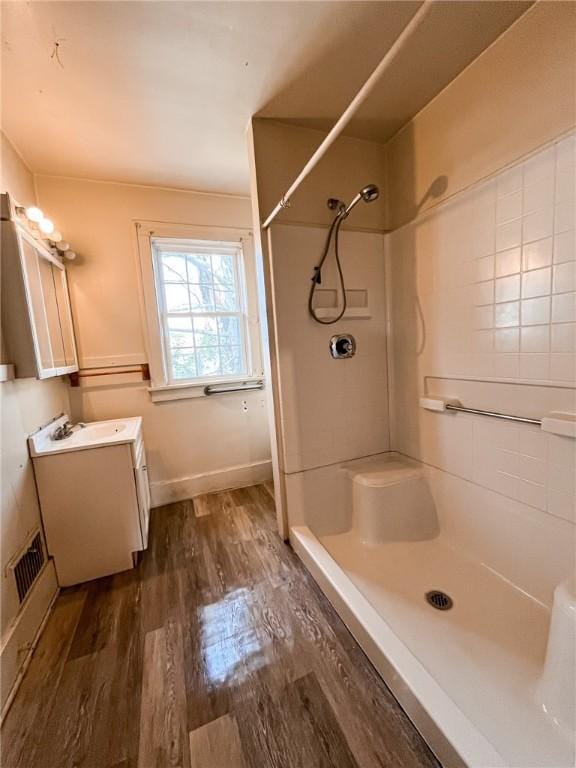 2406 Banker St, Mckeesport, PA 15132 - bathroom featuring vanity, wood finished floors, and a shower