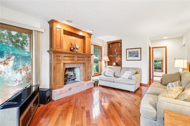 1386 Royal Oak Dr, Marshall, PA 15090 - living area with healthy amount of natural light, light wood-type flooring, a brick fireplace, and recessed lighting