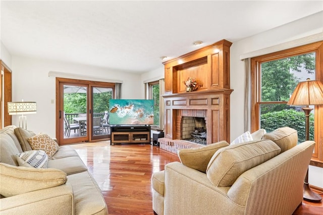 1386 Royal Oak Dr, Marshall, PA 15090 - living room with plenty of natural light, a brick fireplace, and wood finished floors
