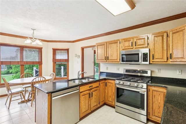 1386 Royal Oak Dr, Marshall, PA 15090 - kitchen featuring appliances with stainless steel finishes, a peninsula, a chandelier, dark stone counters, and ornamental molding