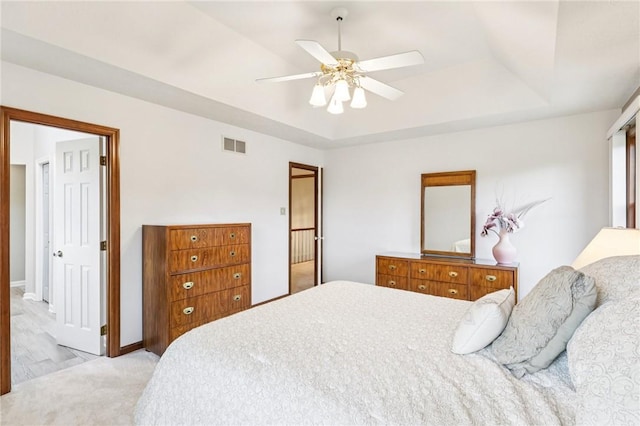 1386 Royal Oak Dr, Marshall, PA 15090 - bedroom with a tray ceiling, light colored carpet, and a ceiling fan