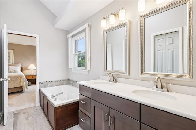 1386 Royal Oak Dr, Marshall, PA 15090 - ensuite bathroom with double vanity, wood finished floors, a bath, and lofted ceiling