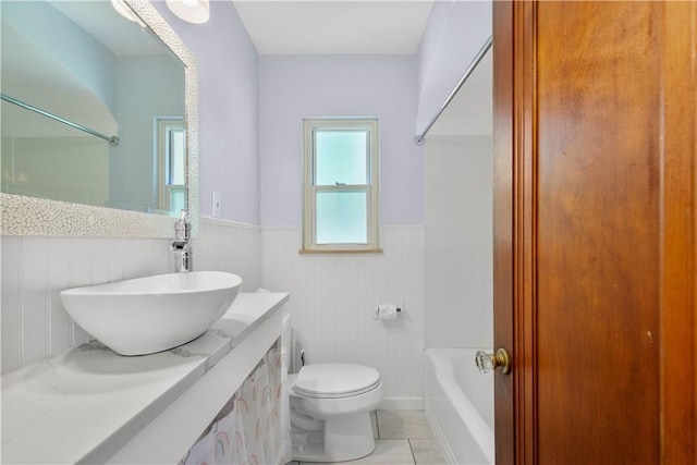 129 Temona Dr, Pleasant Hills, PA 15236 - bathroom featuring vanity, a wainscoted wall, tile patterned floors, and shower / tub combination