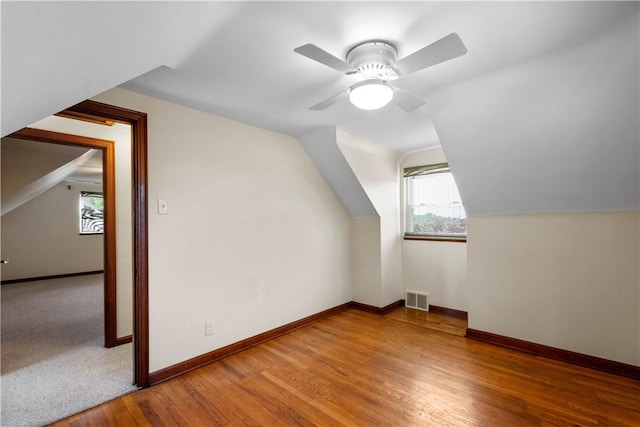 129 Temona Dr, Pleasant Hills, PA 15236 - additional living space with wood finished floors, lofted ceiling, and a ceiling fan