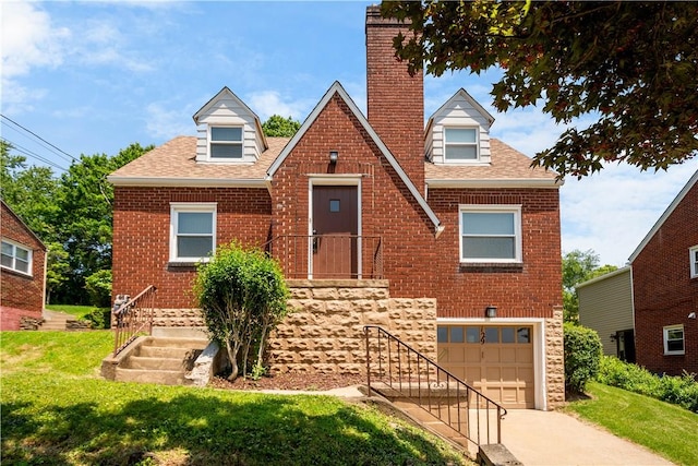 129 Temona Dr, Pleasant Hills, PA 15236 - view of front facade featuring driveway, brick siding, an attached garage, a front lawn, and roof with shingles