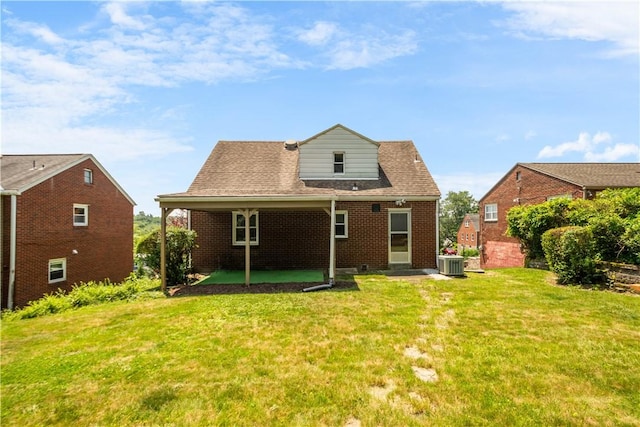 129 Temona Dr, Pleasant Hills, PA 15236 - rear view of house with brick siding, a yard, and a patio area