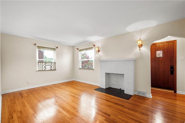 129 Temona Dr, Pleasant Hills, PA 15236 - unfurnished living room featuring wood finished floors and a fireplace