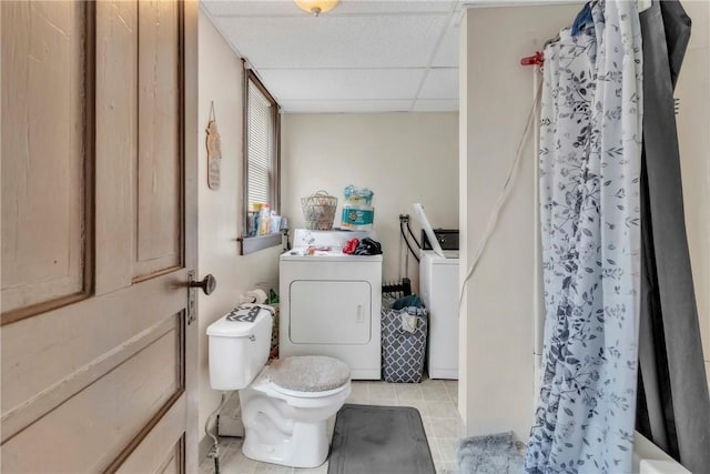 957-959 5th Ave, East Mckeesport, PA 15035 - bathroom featuring washing machine and clothes dryer, a drop ceiling, and tile patterned flooring