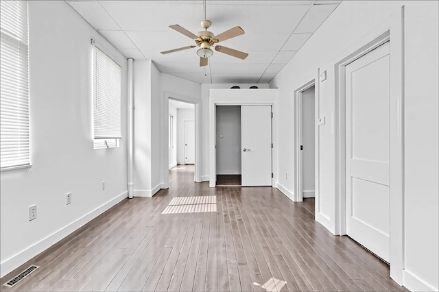 957-959 5th Ave, East Mckeesport, PA 15035 - unfurnished bedroom featuring wood finished floors, multiple closets, and a ceiling fan