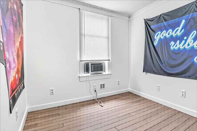 957-959 5th Ave, East Mckeesport, PA 15035 - spare room with wood finished floors, ornamental molding, and cooling unit