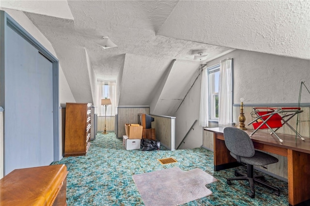 1908 Saint Paul St, South Side, PA 15203 - additional living space featuring a textured ceiling, lofted ceiling, carpet flooring, a desk, and wooden walls
