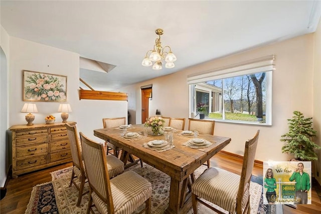 201 Hickory Way, Oakmont, PA 15139 - dining area featuring a chandelier, wood finished floors, and arched walkways