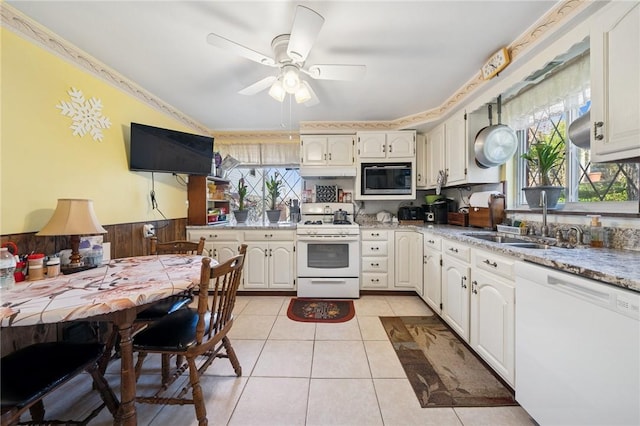 201 Hickory Way, Oakmont, PA 15139 - kitchen with white appliances, ceiling fan, light tile patterned floors, wainscoting, and white cabinetry