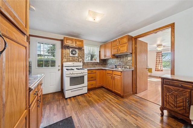 201 Hickory Way, Oakmont, PA 15139 - kitchen featuring white range with gas cooktop, dark wood-style flooring, decorative backsplash, and healthy amount of natural light