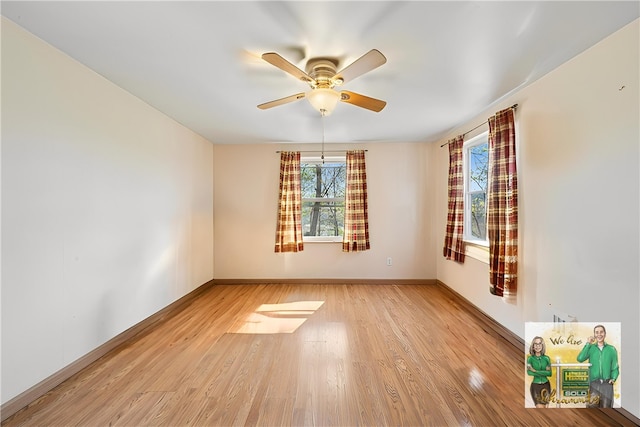 201 Hickory Way, Oakmont, PA 15139 - empty room with healthy amount of natural light, wood finished floors, and a ceiling fan