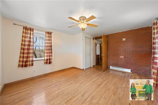 201 Hickory Way, Oakmont, PA 15139 - unfurnished room with baseboard heating, a ceiling fan, brick wall, and wood finished floors