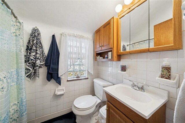 201 Hickory Way, Oakmont, PA 15139 - bathroom with tile walls, vanity, and curtained shower