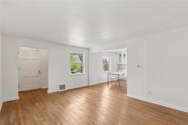 221 Miller Ave, Duquesne, PA 15110 - unfurnished living room with light wood-style floors and baseboards