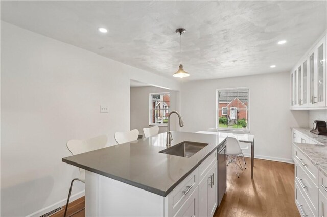 221 Miller Ave, Duquesne, PA 15110 - kitchen featuring a kitchen bar, dishwasher, white cabinets, and recessed lighting