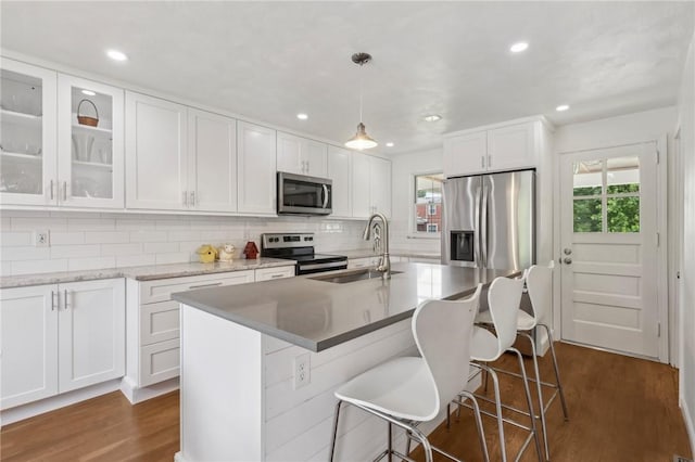 221 Miller Ave, Duquesne, PA 15110 - kitchen featuring stainless steel appliances, healthy amount of natural light, backsplash, white cabinets, and recessed lighting