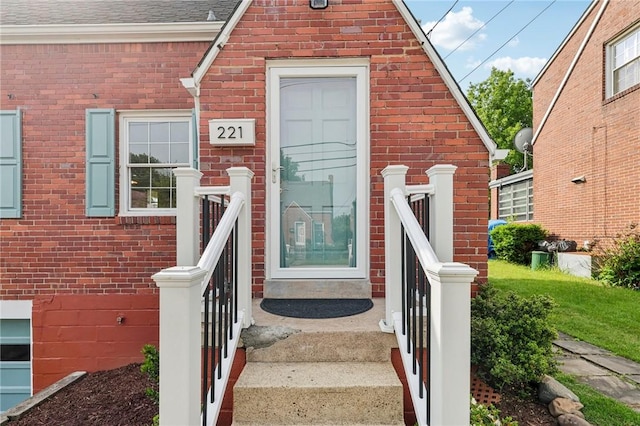 221 Miller Ave, Duquesne, PA 15110 - doorway to property featuring brick siding and roof with shingles