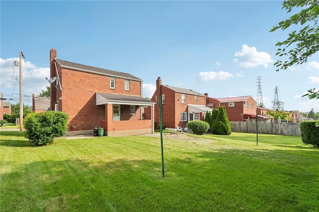 221 Miller Ave, Duquesne, PA 15110 - rear view of property featuring brick siding and a chimney