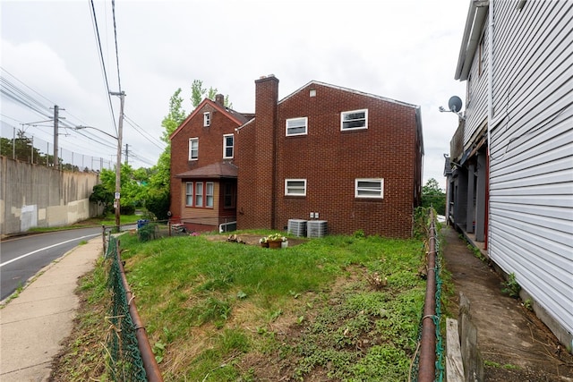 2341 Candace St, Beechview, PA 15216 - view of property exterior featuring a central AC unit and brick siding