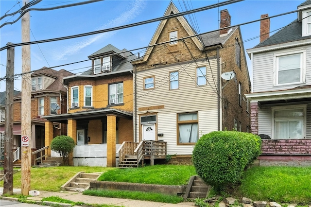 2952 Zephyr Ave, Sheraden, PA 15204 - view of front facade featuring a front lawn