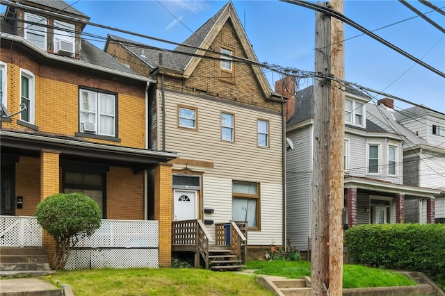 2952 Zephyr Ave, Sheraden, PA 15204 - view of front of home with brick siding, covered porch, and cooling unit