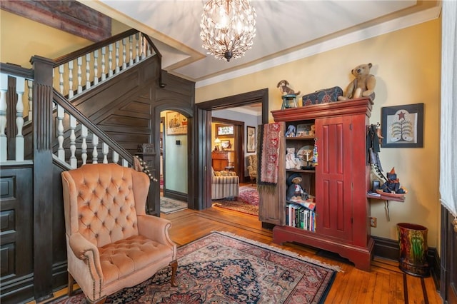 125 Richey Ave, Observatory Hill, PA 15214 - sitting room with hardwood / wood-style floors, a chandelier, arched walkways, crown molding, and stairway