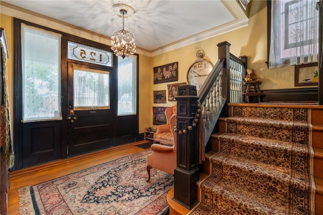 125 Richey Ave, Observatory Hill, PA 15214 - entrance foyer featuring wood finished floors, a chandelier, stairway, and ornamental molding