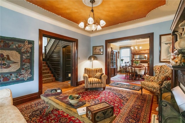 125 Richey Ave, Observatory Hill, PA 15214 - living area with a chandelier, stairs, wood finished floors, and crown molding
