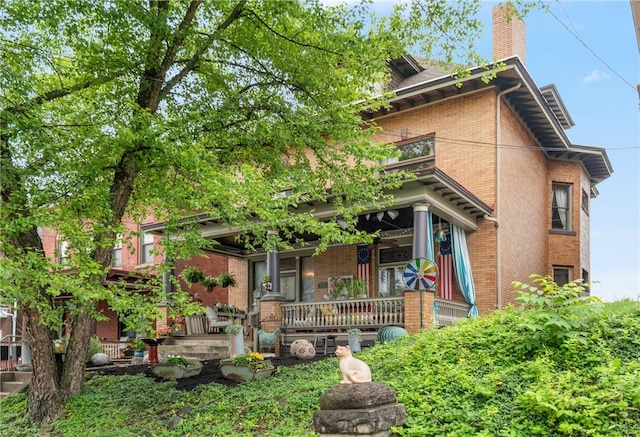 125 Richey Ave, Observatory Hill, PA 15214 - view of front of house with a porch, brick siding, and a chimney
