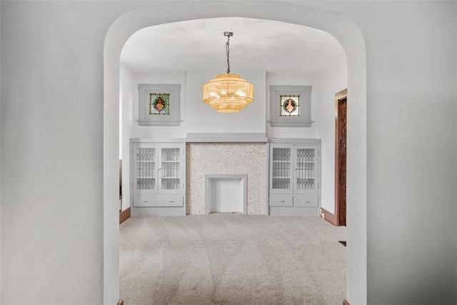 3123 Willett Rd, Brentwood, PA 15227 - unfurnished living room with arched walkways, a chandelier, and carpet floors
