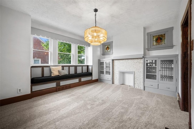 3123 Willett Rd, Brentwood, PA 15227 - unfurnished living room featuring a textured ceiling, a chandelier, and carpet floors