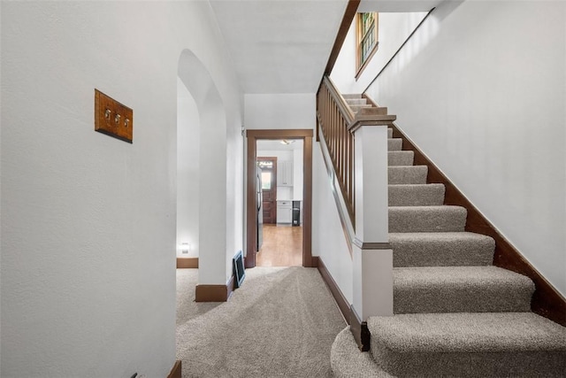 3123 Willett Rd, Brentwood, PA 15227 - staircase with arched walkways and carpet flooring