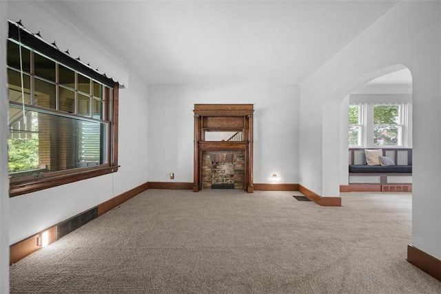 3123 Willett Rd, Brentwood, PA 15227 - unfurnished living room with carpet flooring and arched walkways
