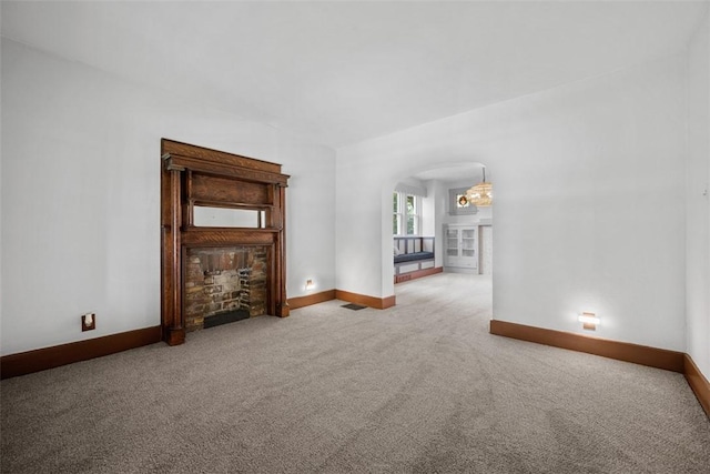 3123 Willett Rd, Brentwood, PA 15227 - unfurnished living room featuring a fireplace, carpet, and arched walkways