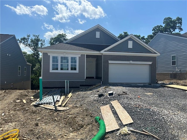 232 Lola Ct, Robinson Twp Nwa, PA 15136 - view of front of house with a garage, driveway, and brick siding