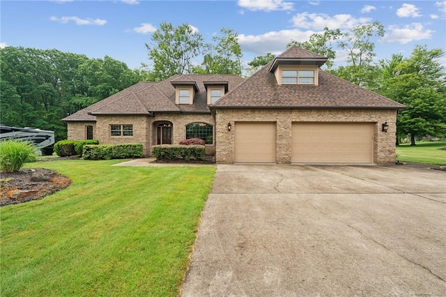 101 Blackthorn Dr, Penn Twp But, PA 16002 - french country style house with an attached garage, a front lawn, brick siding, driveway, and roof with shingles