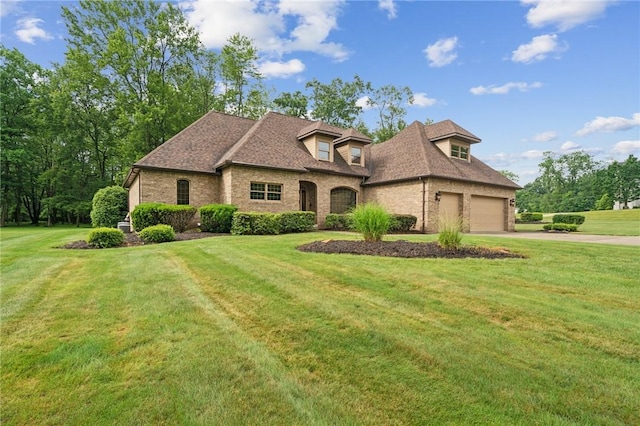 101 Blackthorn Dr, Penn Twp But, PA 16002 - view of front of property featuring concrete driveway, brick siding, an attached garage, and a front yard