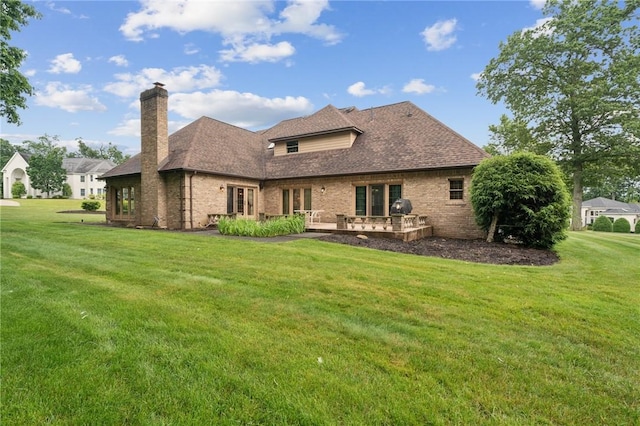 101 Blackthorn Dr, Penn Twp But, PA 16002 - back of house featuring a chimney, a lawn, brick siding, and french doors