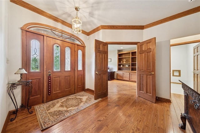 101 Blackthorn Dr, Penn Twp But, PA 16002 - entrance foyer featuring a chandelier, crown molding, and wood-type flooring