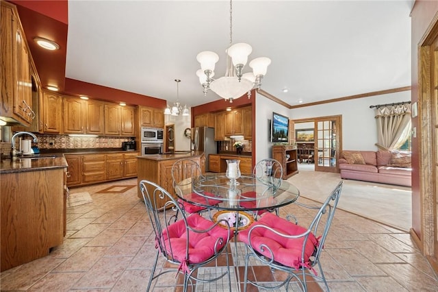 101 Blackthorn Dr, Penn Twp But, PA 16002 - dining space featuring a chandelier, stone tile floors, and crown molding